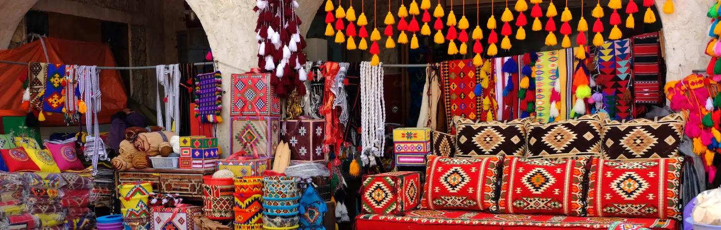 Traditional oriental carpets and pillows at Souq Waqif, Doha, Qatar.