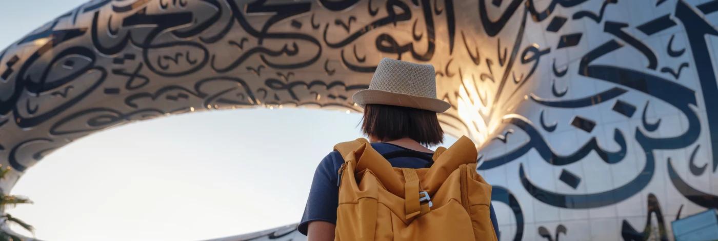 Woman tourist near Museum of The Future - TravelVerse Woman tourist near Museum of The Future - TravelVerse
